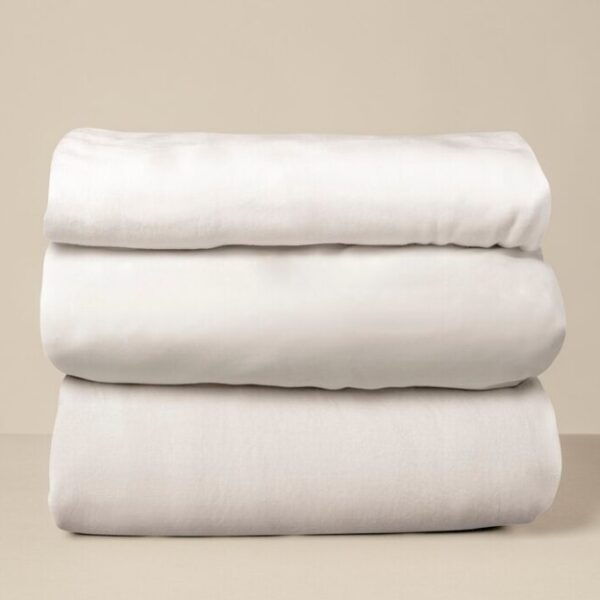 stacked-white-bed-linen_53876-146633